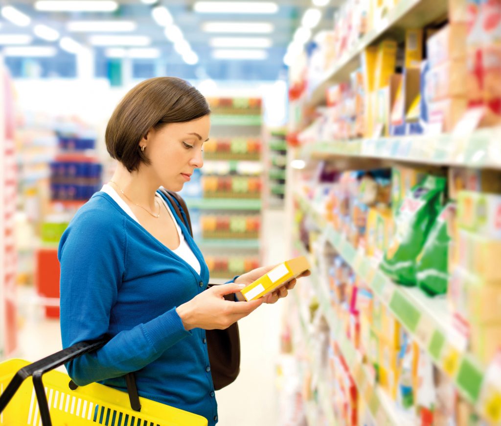Woman checking food labeling
