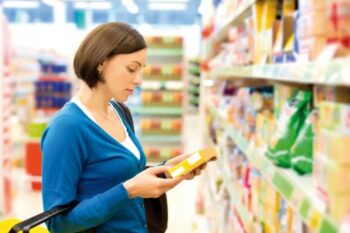 Woman checking food labeling