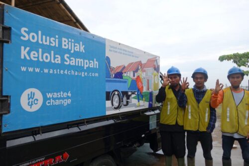Waste4Change’s operators posing in front of our garbage truck.