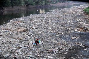 Children were seen playing in the polluted Citarum river in West Java.  Photo credit: Donny Iqbal/Mongabay Indonesia